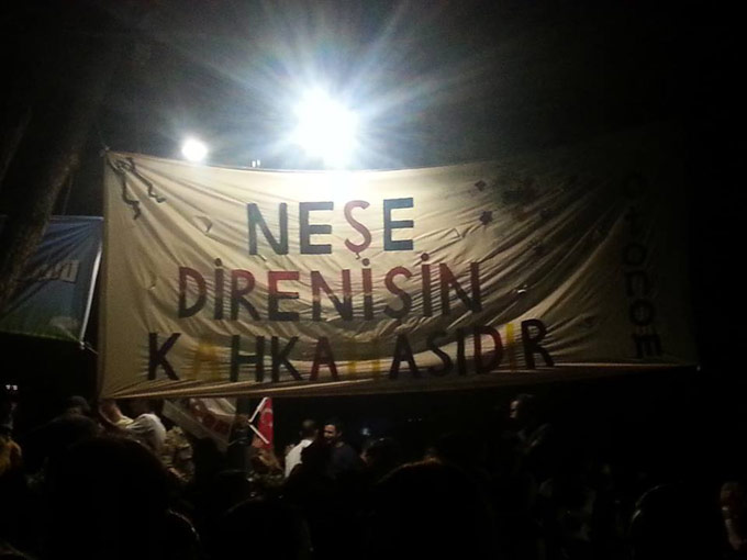 Protesters in Istanbul's Gezi Park hold a banner that reads, "Joy is the laughter of resistance." Photo by Defne Ayas, June 3, 2013.