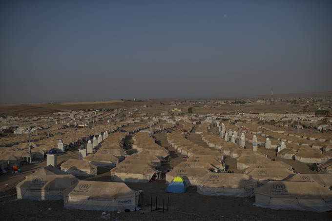Kawergost camp outside of Erbil, in northern Iraq. The mostly ethnically Kurdish refugees are fleeing increasing insecurity, economic strife and a shortage of electricity, water and food. Photo by Lynsey Addario, August 23, 2013.