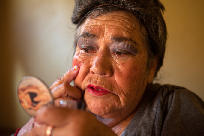 Amalia, a resident at Casa Xochiquetzal, puts on make up before going out to work on the streets of La Merced. Photo by Benedicte Deserus, 2010.
